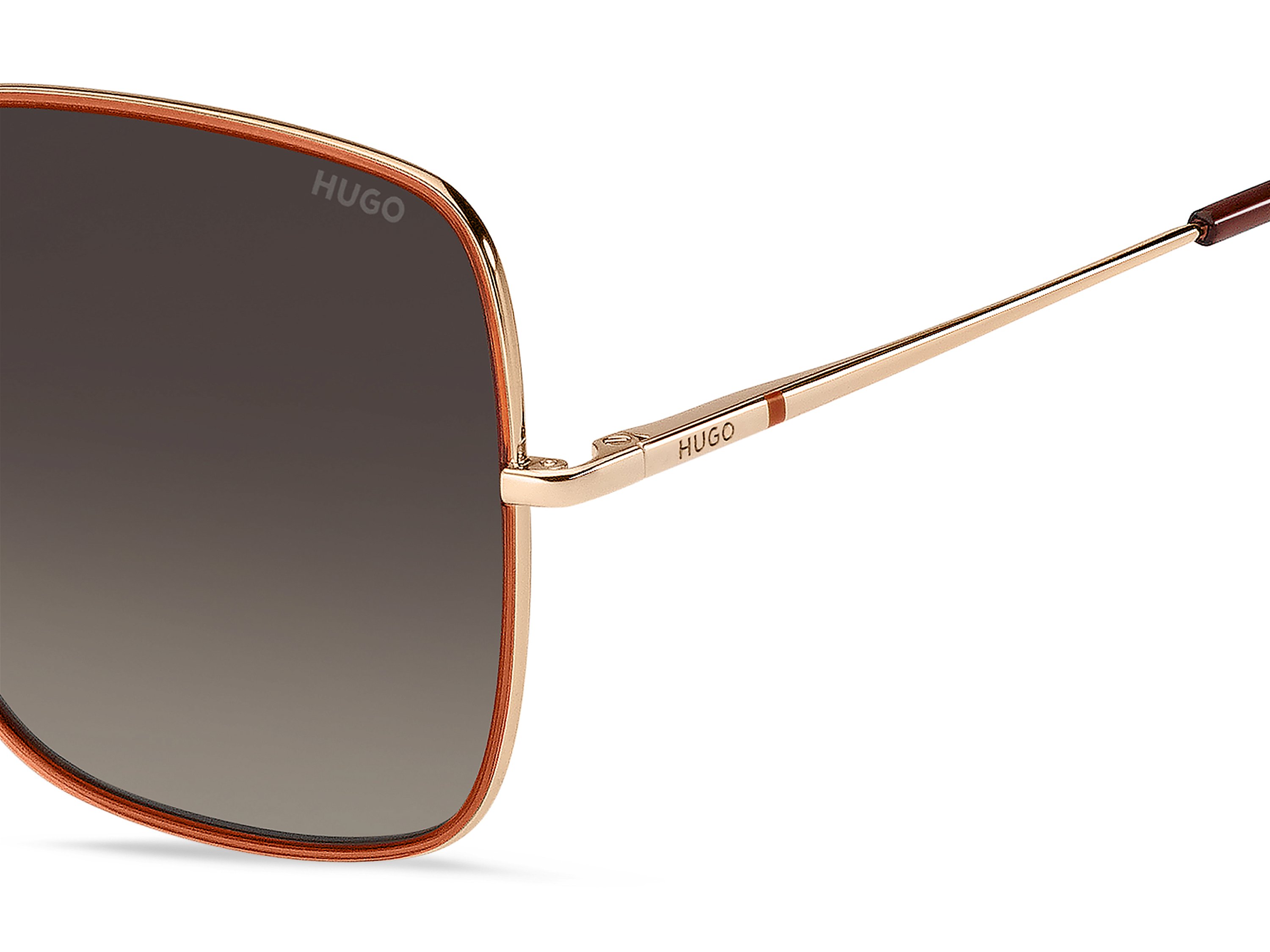 Das Bild zeigt die Sonnenbrille HG1293/S OFY von der Marke Hugo in gold/orange.