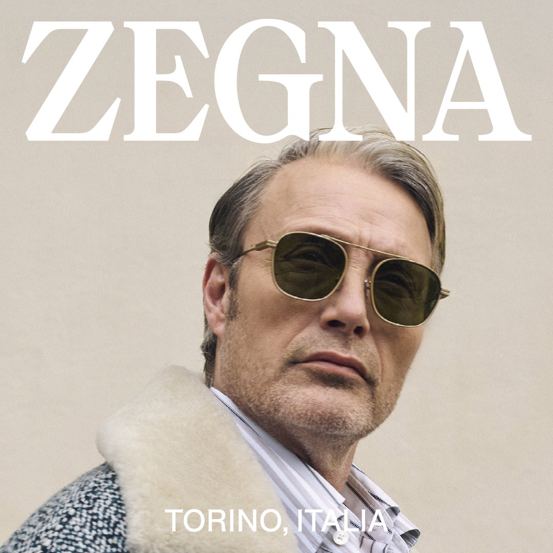 Das Bild zeit das Gesicht eines Mannes mit einer Sonnenbrille. Über ihm steht das Zegna Logo.
